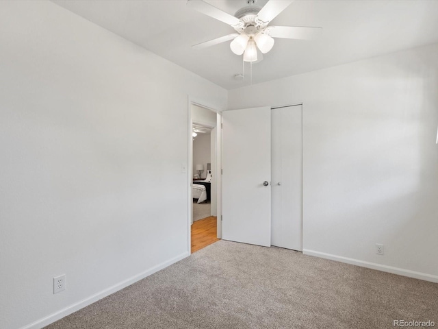 1067 E 15th Ave, Broomfield, CO 80020 - unfurnished bedroom with light carpet, a closet, and a ceiling fan