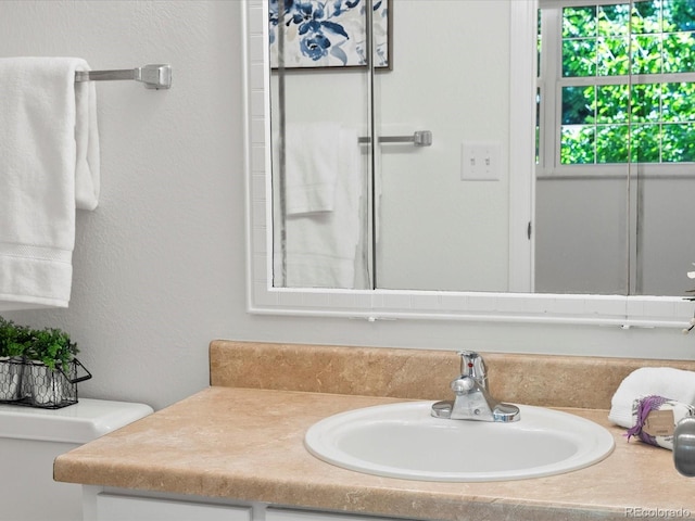 1067 E 15th Ave, Broomfield, CO 80020 - bathroom featuring vanity and a textured wall
