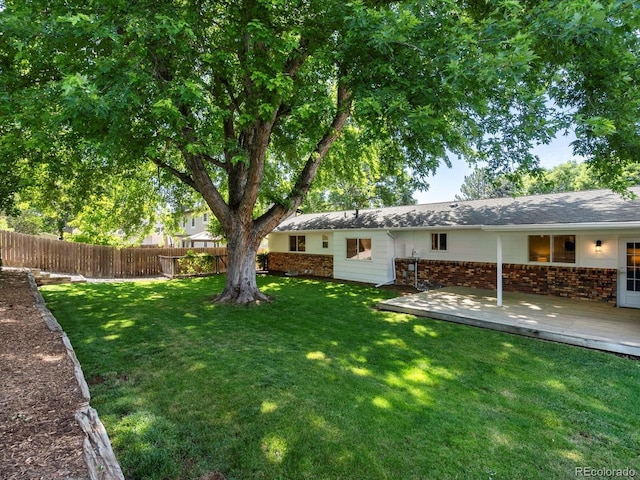 1067 E 15th Ave, Broomfield, CO 80020 - view of yard with a wooden deck