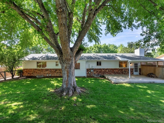 1067 E 15th Ave, Broomfield, CO 80020 - back of property with brick siding and a chimney