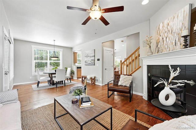 9134 E 29th Pl, Denver, CO 80238 - living area featuring wood finished floors, baseboards, ceiling fan, and recessed lighting