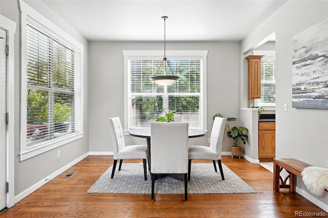 9134 E 29th Pl, Denver, CO 80238 - dining area featuring healthy amount of natural light, light wood-style floors, and baseboards