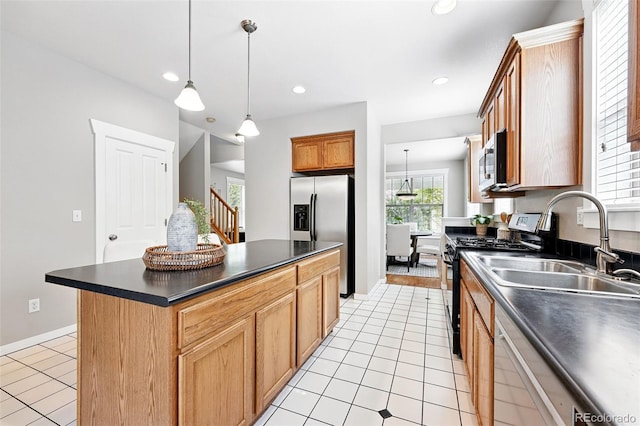 9134 E 29th Pl, Denver, CO 80238 - kitchen with appliances with stainless steel finishes, dark countertops, a sink, light tile patterned floors, and hanging light fixtures