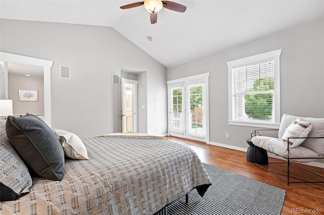9134 E 29th Pl, Denver, CO 80238 - bedroom with access to exterior, wood finished floors, vaulted ceiling, a ceiling fan, and baseboards