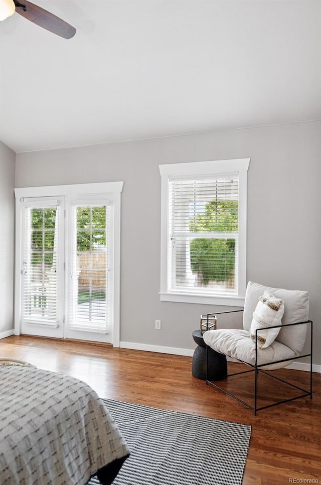 9134 E 29th Pl, Denver, CO 80238 - bedroom with access to outside, wood finished floors, baseboards, and ceiling fan