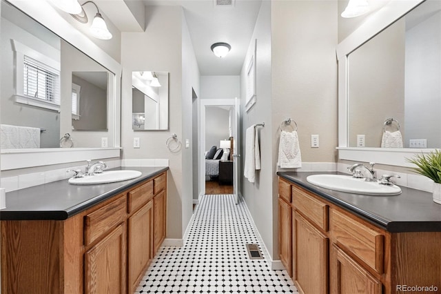 9134 E 29th Pl, Denver, CO 80238 - ensuite bathroom with vanity and tile patterned floors