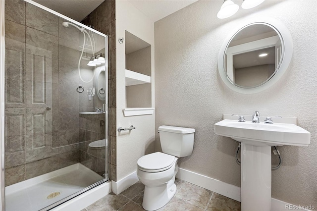 9134 E 29th Pl, Denver, CO 80238 - full bathroom featuring toilet, a stall shower, tile patterned floors, and baseboards