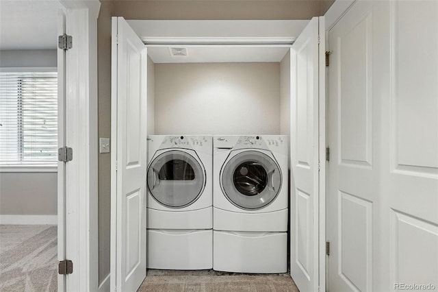 9134 E 29th Pl, Denver, CO 80238 - laundry room with washer and clothes dryer and light colored carpet