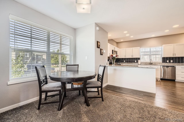 202 Ash St, Bennett, CO 80102 - dining room with dark wood-style floors, baseboards, and recessed lighting
