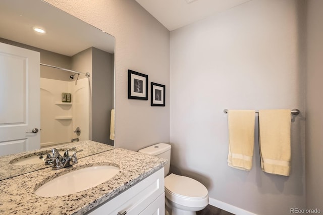 202 Ash St, Bennett, CO 80102 - full bathroom with a shower, vanity, toilet, and recessed lighting