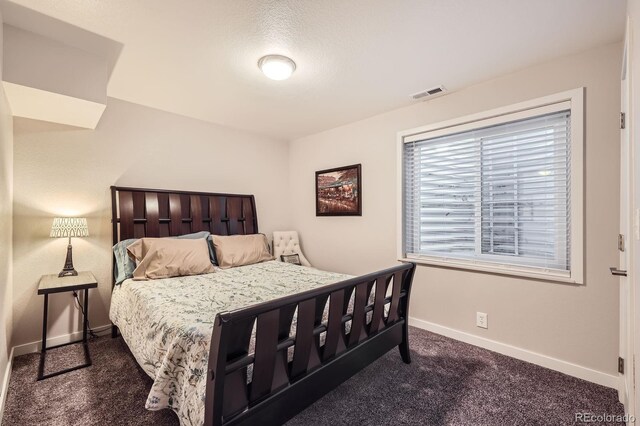 202 Ash St, Bennett, CO 80102 - bedroom featuring baseboards and carpet floors