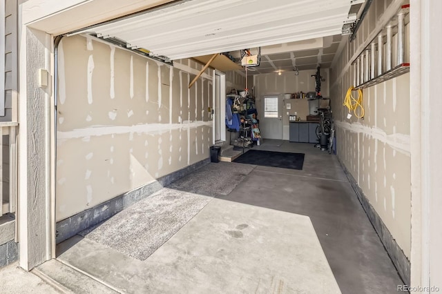 202 Ash St, Bennett, CO 80102 - garage with a garage door opener