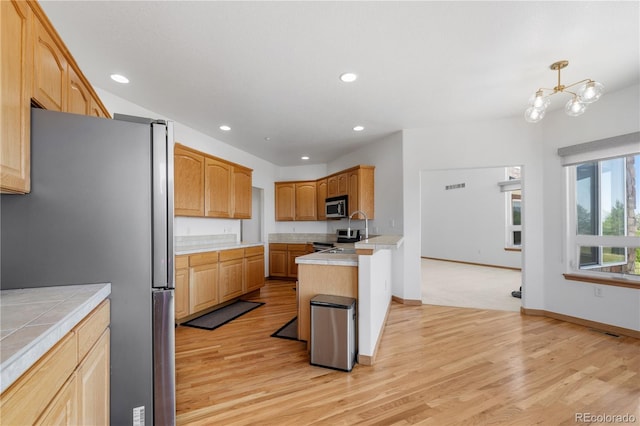34771 E 153rd Ct, Hudson, CO 80642 - kitchen with appliances with stainless steel finishes, light wood finished floors, tile counters, recessed lighting, and a chandelier