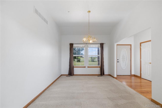 34771 E 153rd Ct, Hudson, CO 80642 - carpeted entryway with a chandelier and baseboards