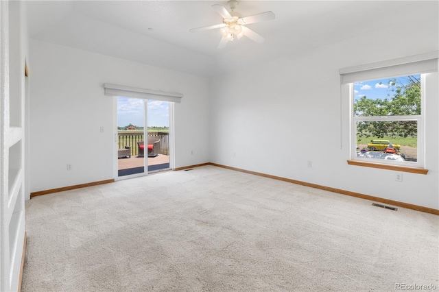 34771 E 153rd Ct, Hudson, CO 80642 - empty room featuring plenty of natural light, light carpet, and ceiling fan