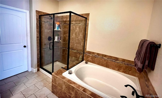 bathroom with shower with separate bathtub and tile patterned floors