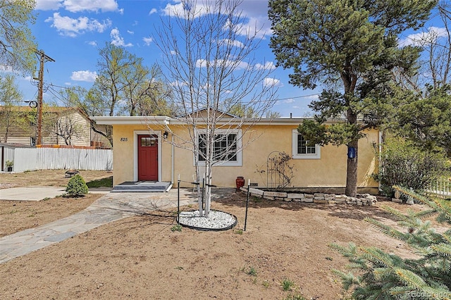 825 Hill Road Ct, Colorado Springs, CO 80909 - view of front of home with stucco siding and fence