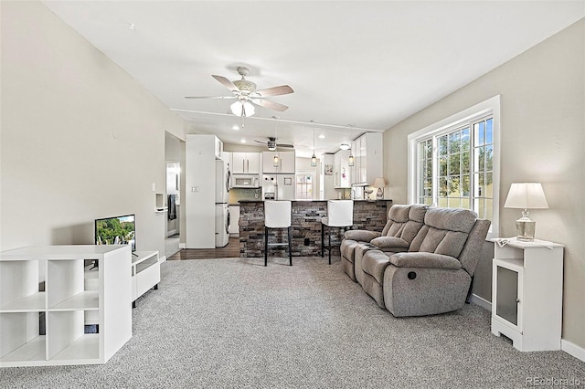 825 Hill Road Ct, Colorado Springs, CO 80909 - living area featuring a ceiling fan, carpet flooring, and baseboards