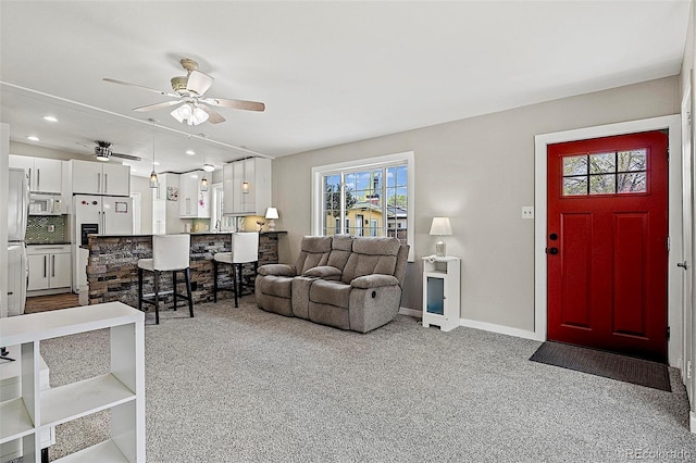 825 Hill Road Ct, Colorado Springs, CO 80909 - living room featuring ceiling fan, carpet, baseboards, and recessed lighting
