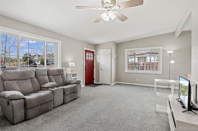 825 Hill Road Ct, Colorado Springs, CO 80909 - living room featuring carpet floors, baseboards, ceiling fan, and lofted ceiling