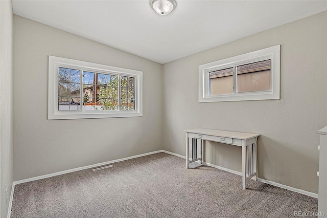 825 Hill Road Ct, Colorado Springs, CO 80909 - carpeted spare room with baseboards