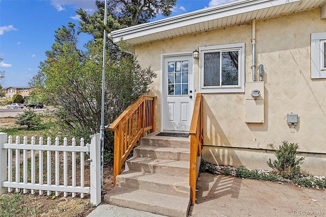 825 Hill Road Ct, Colorado Springs, CO 80909 - entrance to property with fence and stucco siding