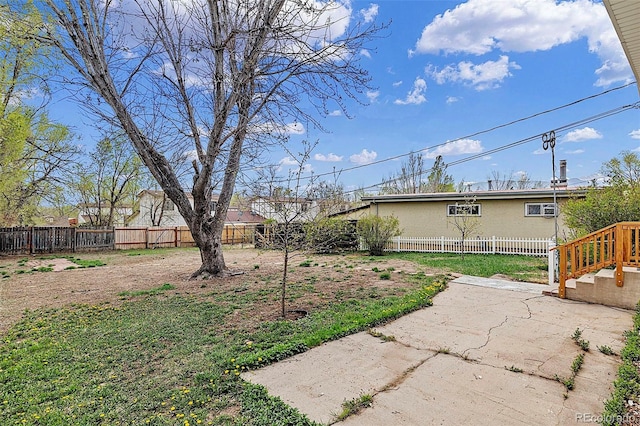825 Hill Road Ct, Colorado Springs, CO 80909 - fenced backyard with a patio area