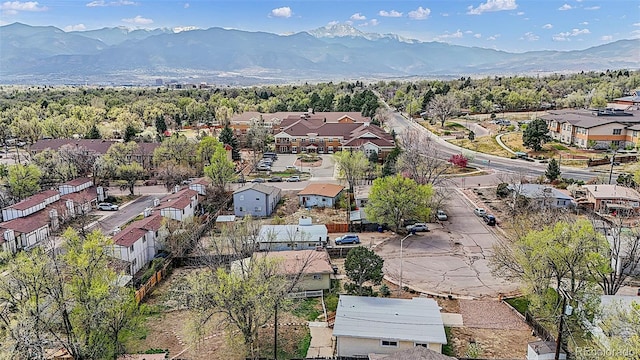 825 Hill Road Ct, Colorado Springs, CO 80909 - aerial perspective of suburban area featuring a mountain backdrop