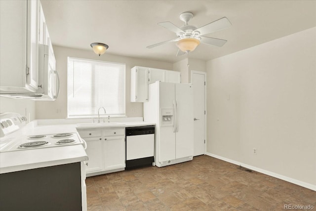 kitchen featuring white appliances, sink, ceiling fan, and white cabinets