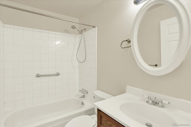 full bathroom featuring vanity, toilet, and tiled shower / bath