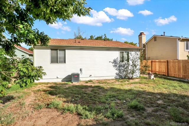 back of house featuring central AC unit