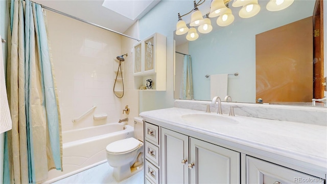 full bathroom featuring shower / tub combo with curtain, toilet, vanity, and a skylight