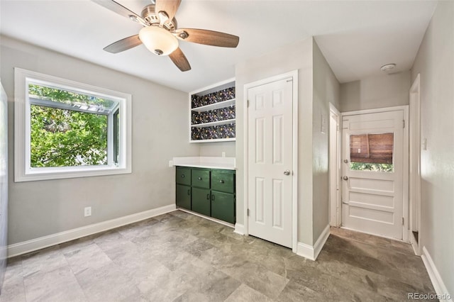 4560 S Fox St, Englewood, CO 80110 - unfurnished bedroom with baseboards and ceiling fan
