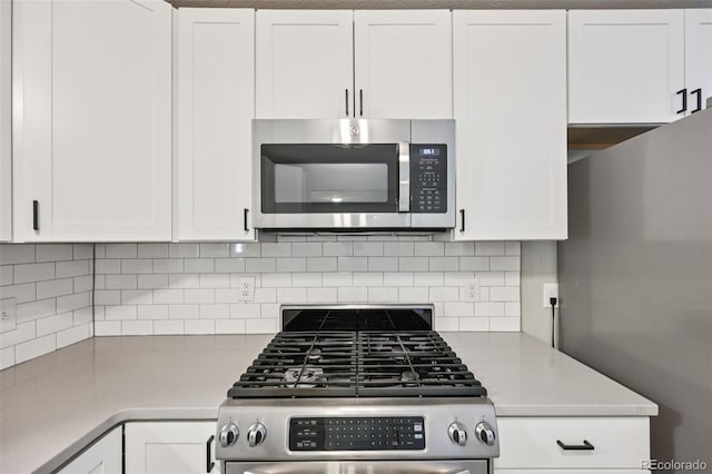 4560 S Fox St, Englewood, CO 80110 - kitchen with stainless steel appliances, light countertops, and white cabinets