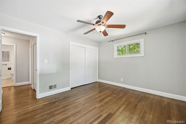 4560 S Fox St, Englewood, CO 80110 - unfurnished bedroom with a closet, wood finished floors, and a ceiling fan