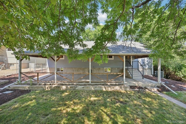 4560 S Fox St, Englewood, CO 80110 - back of property featuring a yard