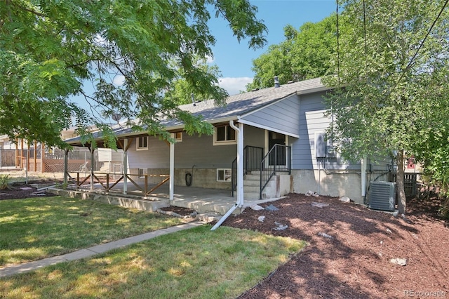 4560 S Fox St, Englewood, CO 80110 - rear view of house with a patio area and a shingled roof
