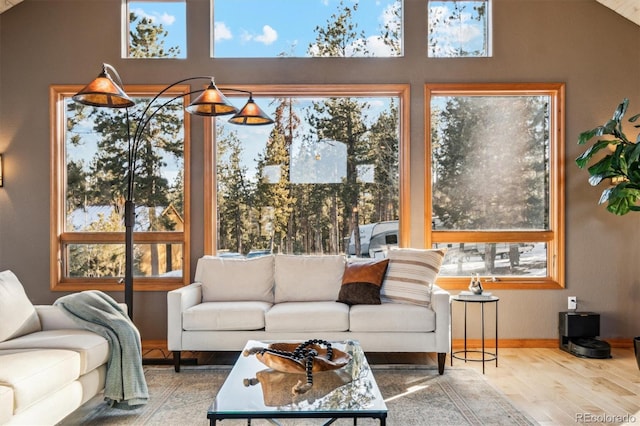 sunroom / solarium with vaulted ceiling and a wealth of natural light