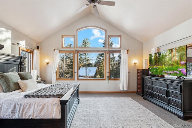 bedroom featuring ceiling fan, high vaulted ceiling, carpet floors, and multiple windows