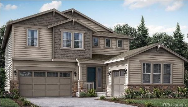 craftsman house with stone siding, driveway, and a garage