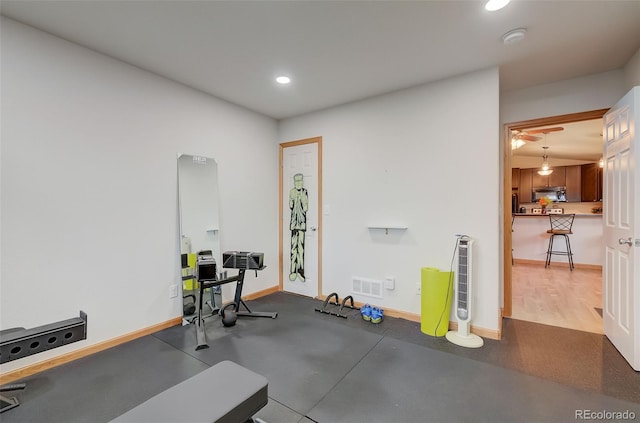 workout area featuring recessed lighting, baseboards, and visible vents