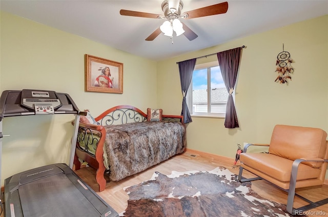 bedroom with wood finished floors and ceiling fan