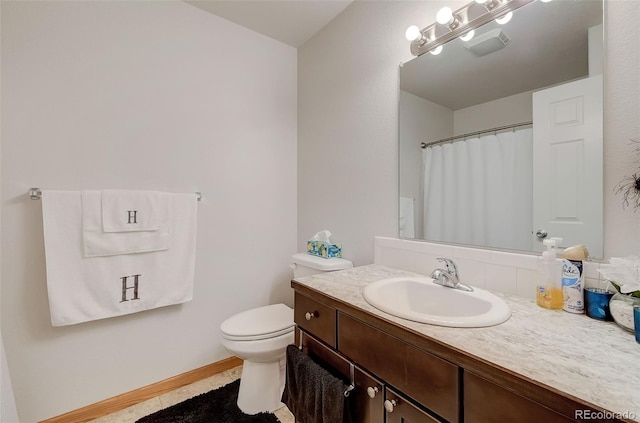 full bathroom with vanity, a shower with curtain, baseboards, tile patterned floors, and toilet