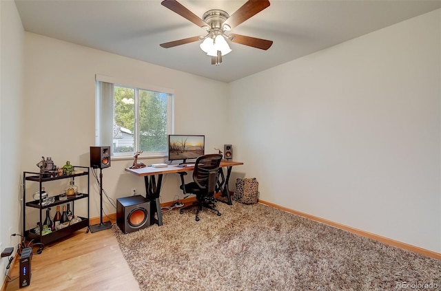 office space with ceiling fan, baseboards, and wood finished floors