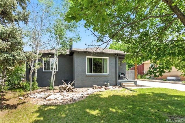 2050 S Wolff St, Denver, CO 80219 - single story home featuring brick siding and a front yard