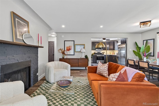 2050 S Wolff St, Denver, CO 80219 - living room featuring wood finished floors, recessed lighting, a fireplace, and ceiling fan