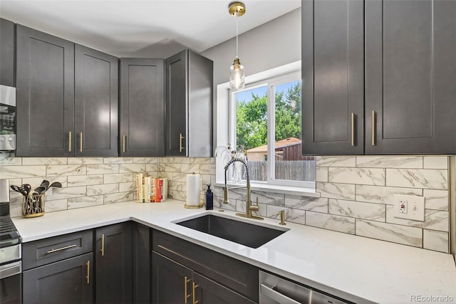 2050 S Wolff St, Denver, CO 80219 - kitchen with decorative backsplash, light countertops, decorative light fixtures, and dishwasher