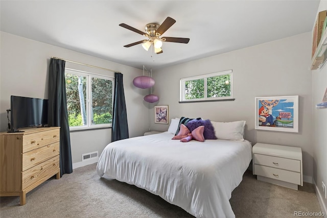 2050 S Wolff St, Denver, CO 80219 - bedroom featuring light carpet and a ceiling fan
