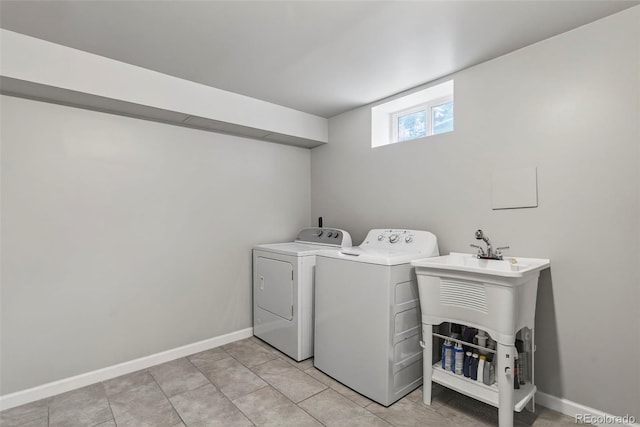 2050 S Wolff St, Denver, CO 80219 - washroom with independent washer and dryer and baseboards