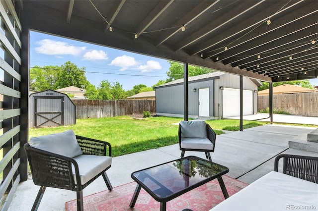 2050 S Wolff St, Denver, CO 80219 - fenced backyard featuring an outdoor structure, a patio, and a detached garage